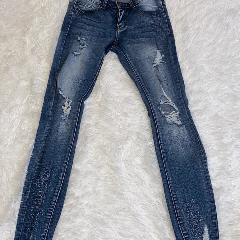 Light wash distressed skinny jeans